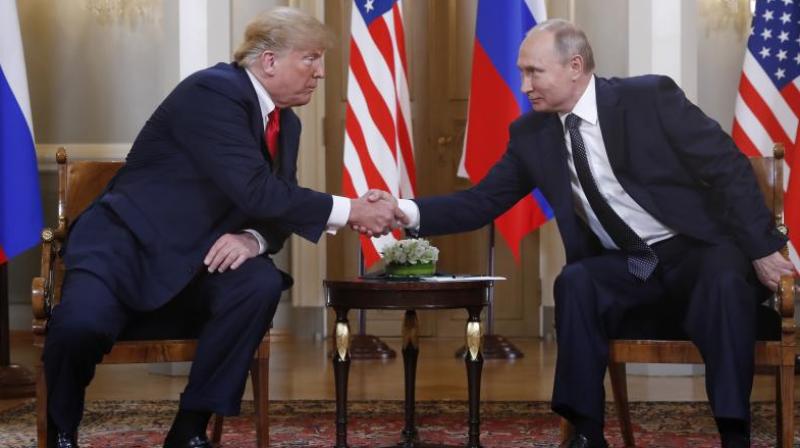 Trump reached out to shake Putins hand before the media were ushered out. (Photo: AP)