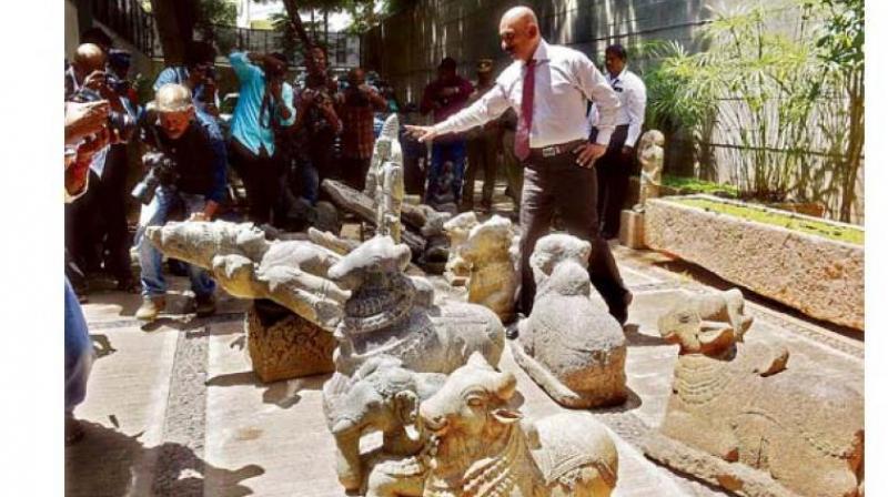 IG Pon Manickavel inspects idol seized from business man house on Thursday.