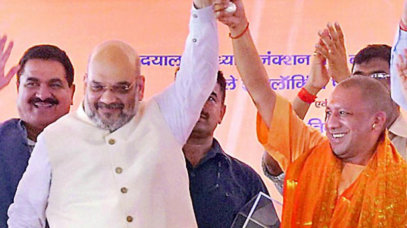BJP national president Amit Shah and Uttar Pradesh Chief Minister Yogi Adityanath during an event to rename the iconic Mughalsarai railway station after Pandit Deen Dayal Upadhyay, on Sunday. (Photo: AP0