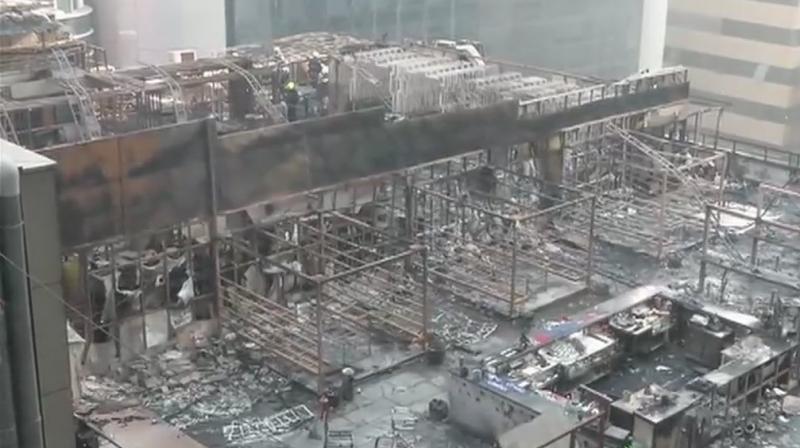 A fire that started at a rooftop pub hosting a birthday party spread rapidly through the building, killing 14 people, most of them women, shortly after midnight in a posh Mumbai locality. (Photo: Twitter | ANI)