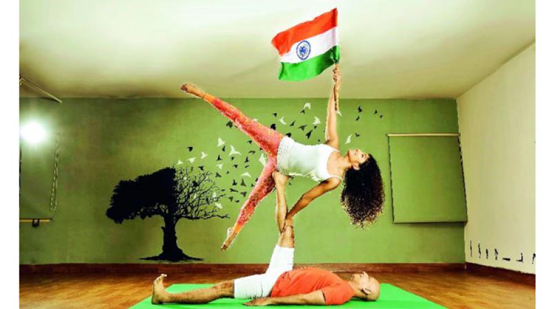 Its Independence day and striking a pose are Nicy Joseph and Kamal Maliramani from Energizer Yoga, Hyderabad expressing their joy and respect for the nation. The posture is called â€œStarâ€ in AcroYoga, just like our nation is a shining star. The picture represents strength, balance and pride.    (Photo Credit: Adrin Sequeira)