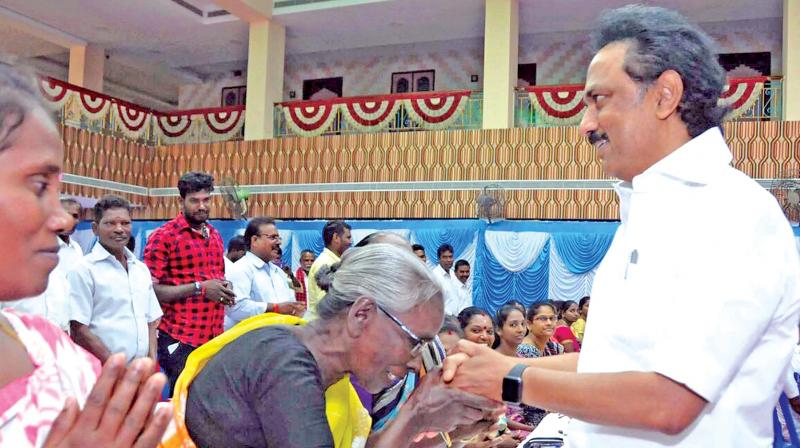 DMK working president M.K. Stalin meets members of the fishermen community at Thiruvottiyur in Chennai on Monday. (Photo: DC)