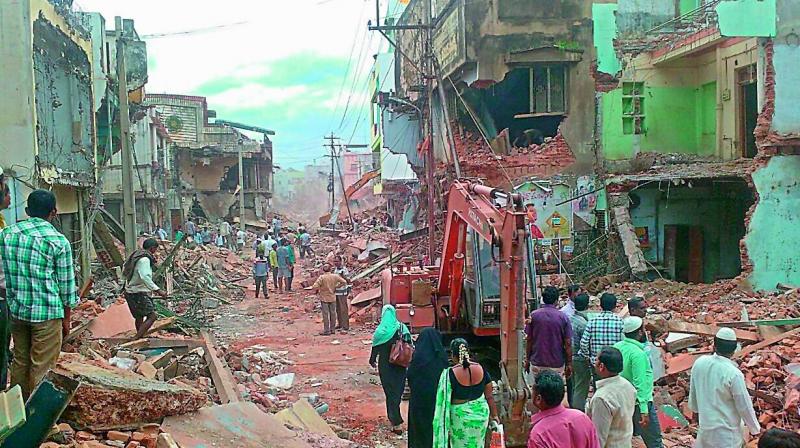 Shops demolished as part of road widening in Nandyal.