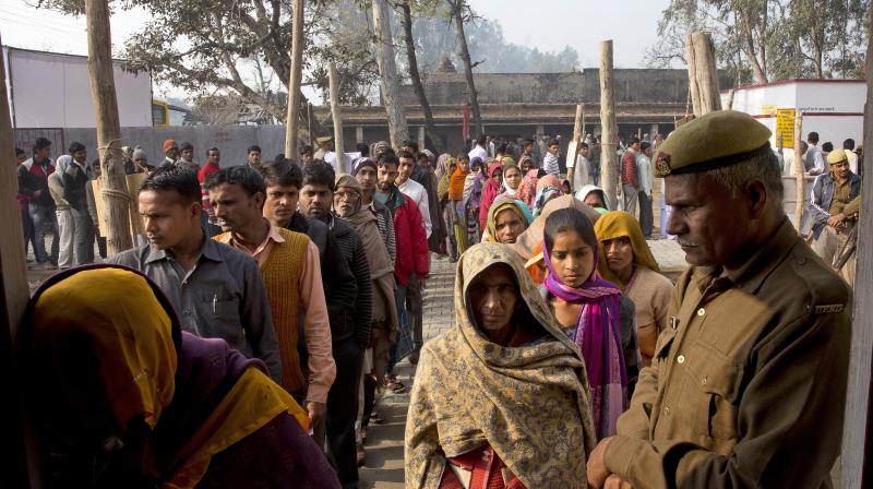 Indians stand in a queue to cast their votes at rural polling station in Shahabajpur Dora village in Uttar Pradesh, India, Wednesday. (Photo: AP)