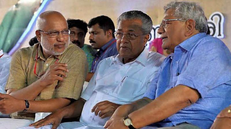 Kerala Chief Minister Pinarayi Vijayan with CPI leader Sitaram Yechury bedore the inaugurate meeting of Democratic Youth Federation of India (DYFI) during the 10th all-India conference in Kochi on Sunday. (Photo: PTI)