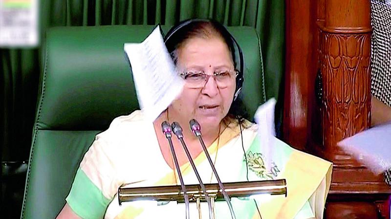 Papers being thrown at Speaker Sumitra Mahajans Chair in the Lok Sabha in New Delhi on Monday. (Photo: PTI)