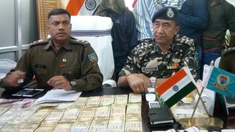 Police with the money seized from the Maoists. (Photo: ANI/Twitter)