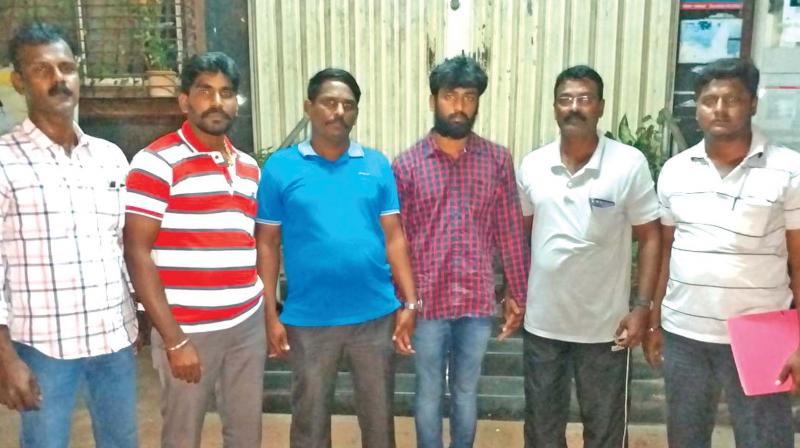 Dhashwant (third from left) caught by city police team.