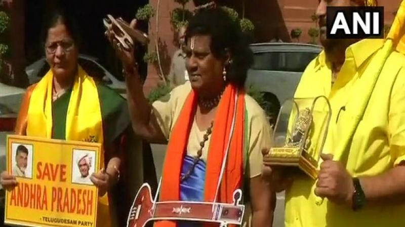 From dressing up as a cattle herder to a schoolboy, Chittoor MP has even donned a sari as part of the protest against denial of the status by the Centre. (Photo: ANI/Twitter)