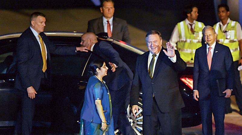 External Affairs Minister Sushma Swaraj greets US Secretary of State Mike Pompeo on his arrival at Palam Airforce Station in New Delhi on Wednesday. (Photo: PTI)