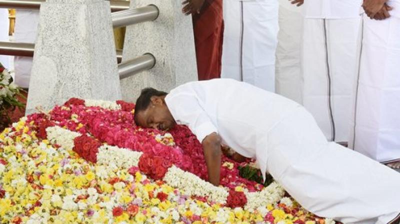 Chief Minister O Panneerselvams cabinet colleague paying homage at the late AIADMK supremo J Jayalalithaa memorial before the first Cabinet meeting in Chennai. (Photo: AP)