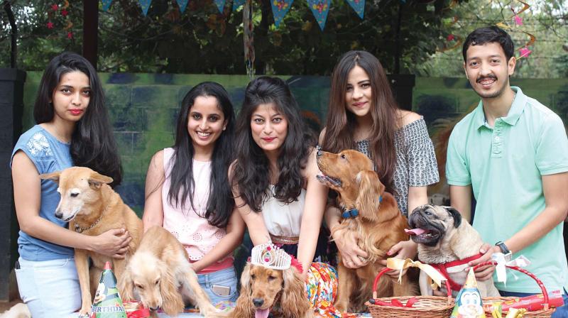 Ankeita (third from left) at a pet cafe with other pet lovers. (Right) Madhurima with her pet