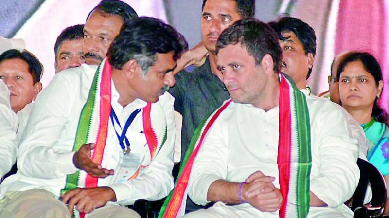 Congress president Rahul Gandhi interacts with former MP Konda Vishweshwar Reddy during a public meeting held in Chevella Constituency on Saturday.