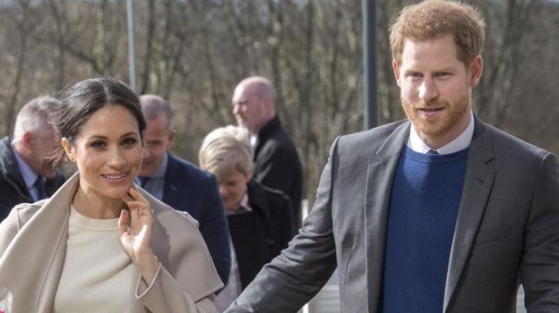 Britains Prince Harry and US actress and fiancee of Britains Prince Harry Meghan Markle arrive at the Eikon Centre in Lisburn, on March 23, 2018, to attend an event to mark the second year of youth-led peace-building initiative Amazing the Space. (Photo: AFP)