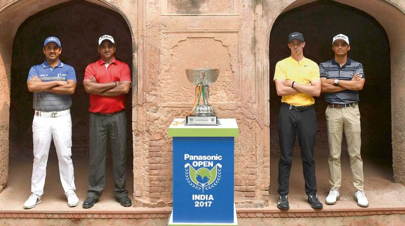 Shiv Kapur (from left), Mukesh Kumar, Paul Peterson and Ajeetesh Sandhu pose with the Panasonic Open trophy at the Delhi Golf Club on Tuesday.