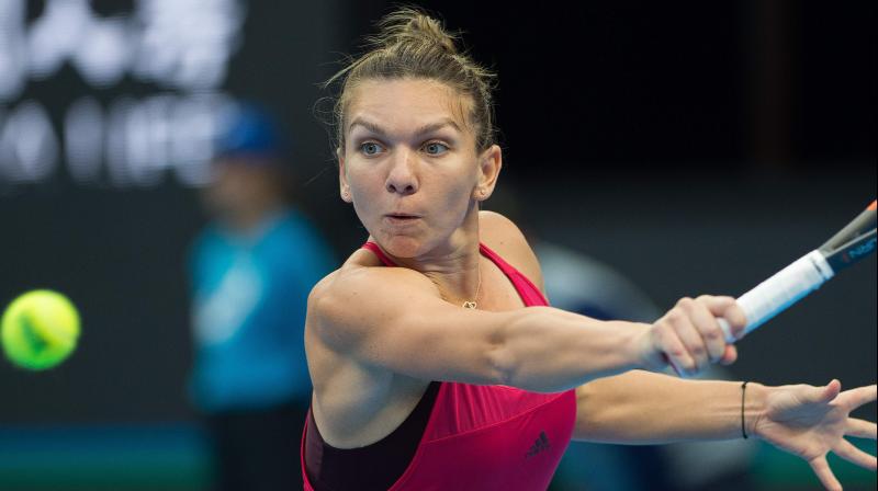 Halep, 27, said she had hoped to compete at the season finale in Singapore, which starts on Sunday, but that she had taken the \tough\ decision to put her health first. (Photo: AFP)