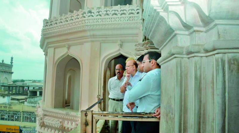A.N. Jha, Union Secretary, admires the view from the Charminar with Arvind Kumar, principal secretary, Municipal Administration and Urban Development, and B. Janardhan Reddy, GHMC commissioner. (Photo: P. surendra)