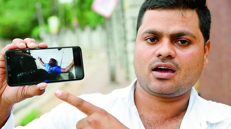 Mohd. Shakeel has alleged that he was roughed up by the Karkhana police for calling up the police control room. Shakeel shows a picture of himself where he is seen lying on the floor in the police station, after he was beaten up. (Photo:DC)