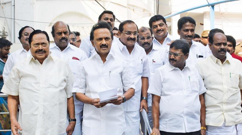 DMK chief M. K. Stalin leads his party members out of the Assembly after boycotting the Governors address on Wednesday.