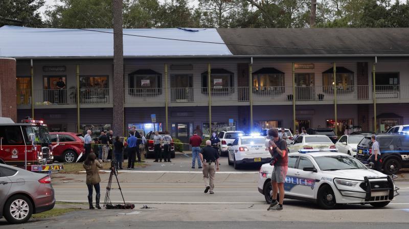 Police investigators work the scene of a shooting in Tallahassee, Florida. (Photo: AP)
