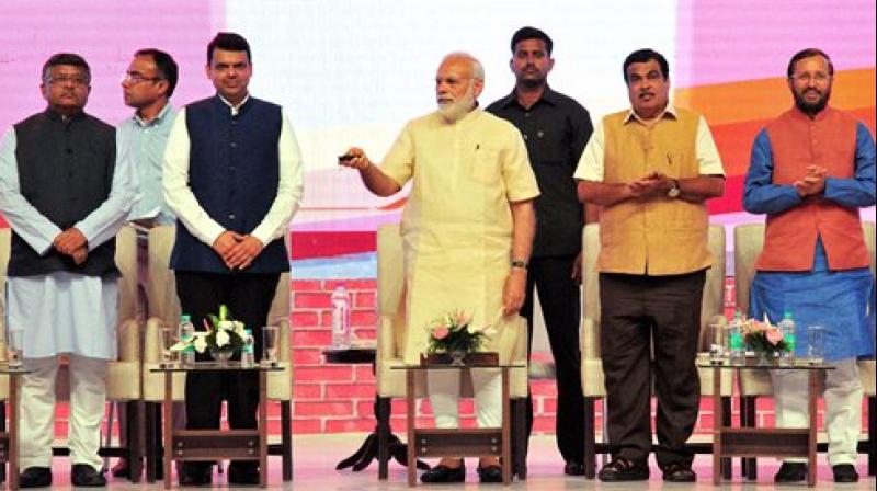 Prime Minister Narendra Modi inaugurates BHIM Aadhar schemes in Nagpur, Maharashtra on Friday. Union Ministers Nitin Gadkari, Ravi Shankar Prasad, Prakash Javadekar and Maharashtra Chief Minister Devendra Fadnavis are also seen.(Photo:PTI)