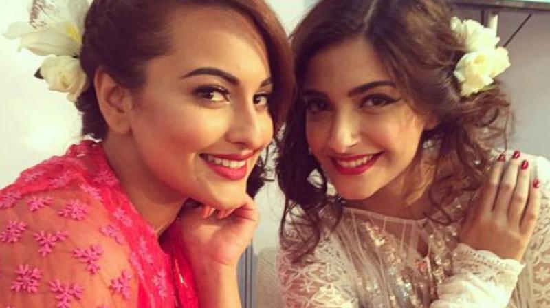 Sonakshi Sinha and Sonam Kapoor at an event.