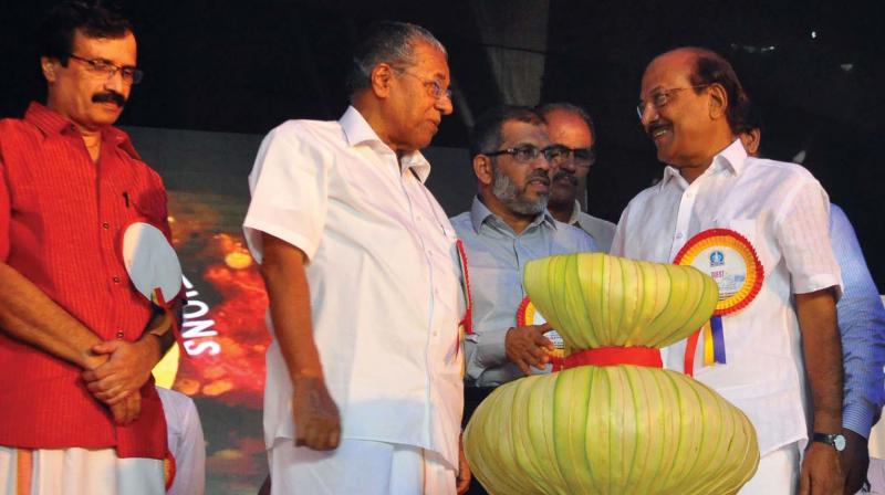 Chief Minister Pinarayi Vijayan along with education minister Prof C. Raveendranath and Malappuram MP  P.K. Kunhalikutty during the inaugural ceremony of the Golden Jubilee celebrations of Calicut University at Thenjippalam on Saturday. (Photo: Viswajith K.)