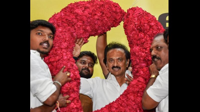 DMK supporters garlanding the newly elected M K Stalin as Party President at a function held at Anna Arivalayam. (Photo: File | PTI)