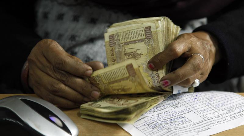 A cashier counts Rs 500 notes at a bank in Allahabad. (Photo: AP)