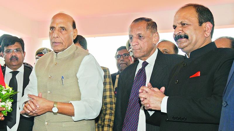 From left: Union home minister Rajnath Singh, Governor E.S.L. Narasimhan and National Investigation Agency director general Y.C. Modi take part in the inauguration ceremony of NIAs office and residential complex in Madhapur on Friday. (Image DC)