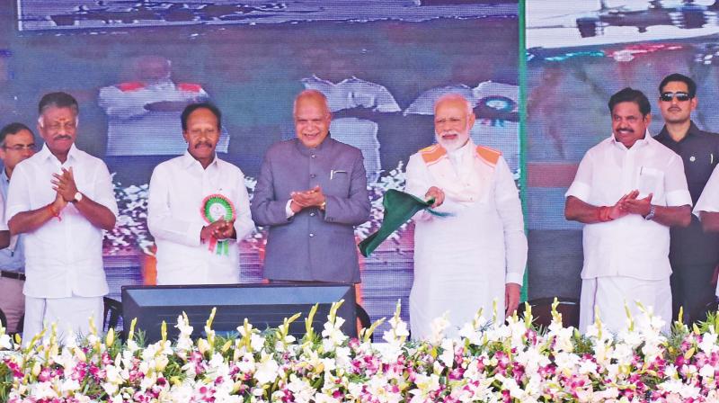 Prime Minister Narendra Modi flags off a new train as part of the basket of new projects launched in Tamil Nadu at a function in Kanyakumari on Friday.