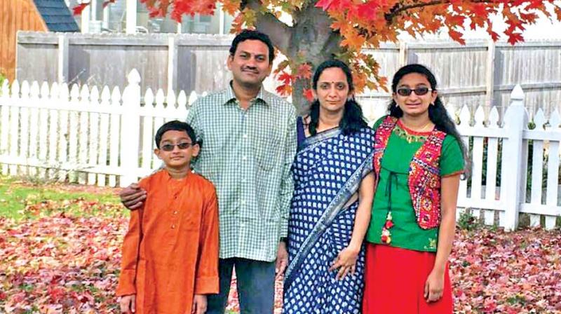 Karthik Narayanan and his wife, Lakshmi, with their  children, Pranav and Samyukta.