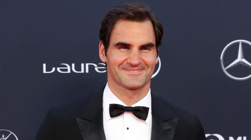 The tennis legend praised his longtime rival, Rafael Nadal while receiving the award. (Photo: AFP)