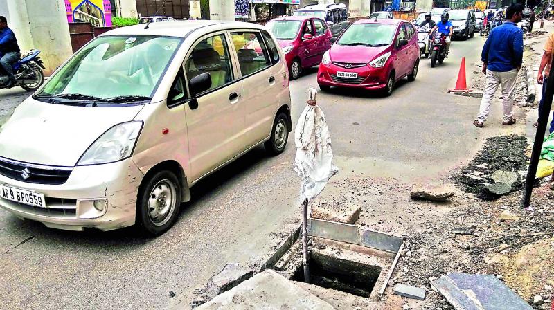 An open manhole at Madhapur remains unattended on Sunday. It poses a serious threat to commuters as the monsoon is here. (Photo: P. Surendra)