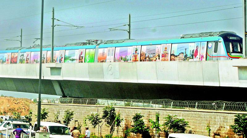 A day before inauguration, the Metro Rail passes through the Miyapur HMR station on Monday. (Photo: DC)