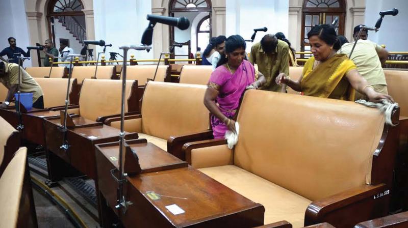 Workers clean old assembly hall on Wednesday. (Photo: DC)