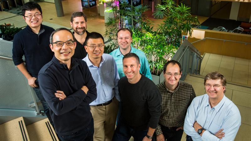 Microsoft researchers from the Speech & Dialog research group include, from back left, Wayne Xiong, Geoffrey Zweig, Xuedong Huang, Dong Yu, Frank Seide, Mike Seltzer, Jasha Droppo and Andreas Stolcke. (Photo: Microsoft blog)