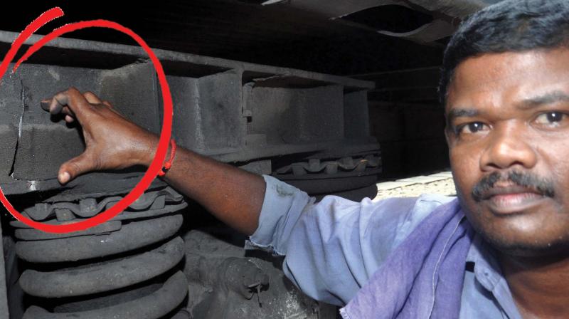 Railway technician T.C Rajeev shows the crack at the train bogie frame in Kochi on Saturday. (Photo: SUNOJ NINAN MATHEW)