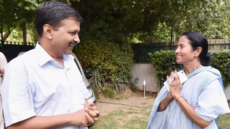 Delhi CM Arvind Kejriwal arrives to meet West Bengal Chief Minister Mamata Banerjee in New Delhi on Wednesday. (Photo: PTI)