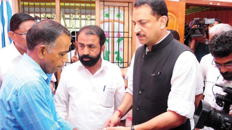 Minister Rajiv Pratap Rudy meets kin of slain RSS worker C. Biju in Kannur on Wednesday. (Photo: DC)
