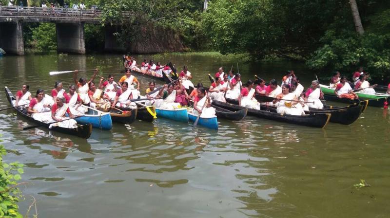 Women participate in the boat race held at Kavalam as part of the birthday celebrations of Kudumbashree on Wednesday.