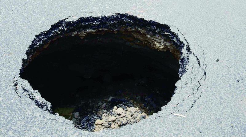 Road opposite Vasthralatha in  I Town in Vijayawada has caved in on Wednesday. (Photo: DC)