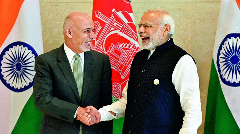Prime Minister Narendra Modi and Afghanistans President Ashraf Ghani in a lighter mood at the Sixth Heart of Asia Conference in Amritsar on Sunday. (Photo: PTI)