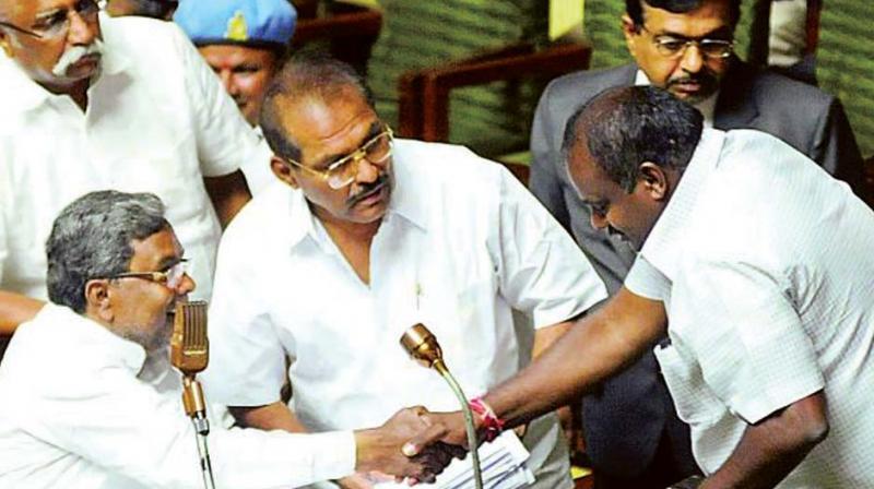 A file photo of CM Siddaramaiah and State JD(S) leader H.D. Kumaraswamy greeting each other during happier times