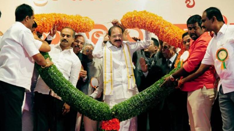Vice President-elect M Venkaiah Naidu being felicitated at a function in Bengaluru on Sunday. (Photo: PTI)
