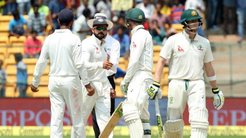 Both Smith and Handscomb seemingly looked up towards the Australian dressing room to seem help regarding a DRS referral. (Photo: BCCI)