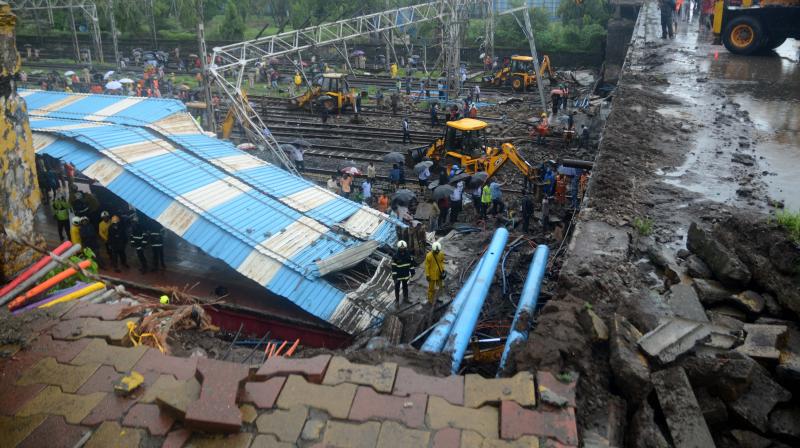 Part of an overbridge collapsed on the railway track near Andheri station amid heavy rains at around 7.30 am on Tuesday. (Photo: Shripad Naik)