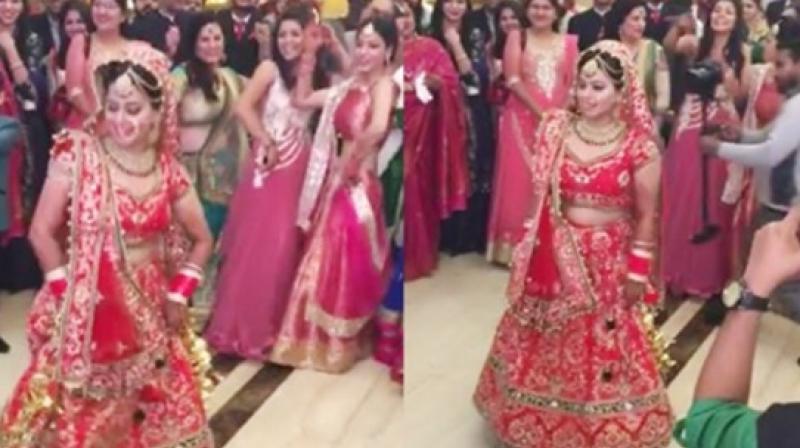 This lovely bride won hearts across the Internet when she showed off some seriously sassy moves before taking part in the marriage rituals. (Credit: Facebook)