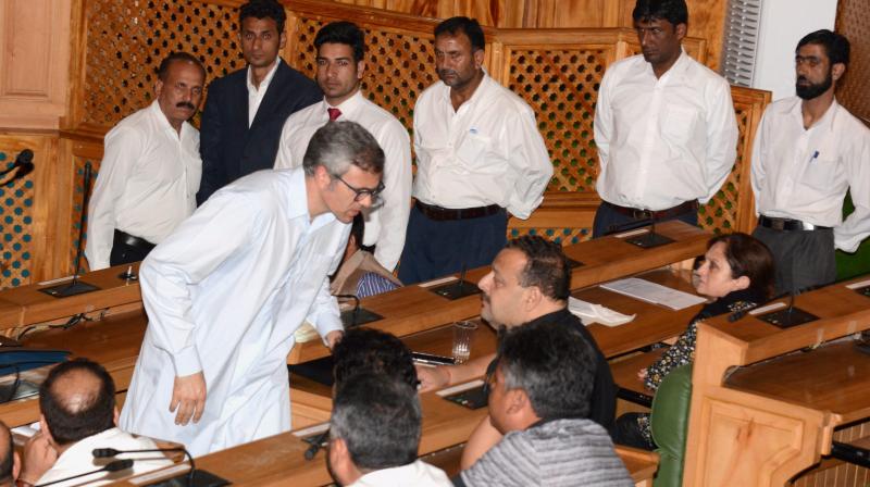 Former Chief Minister of Jammu and Kashmir and Leader of Opposition National Conference Omar Abdullah discussing with his party MLAs during the Special Session of Legislative Assembly called to pass the Goods and Services Tax (GST) bill, in Srinagar on Wednesday. (Photo: PTI)