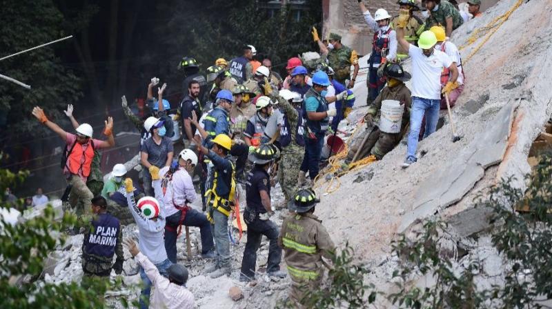 A powerful earthquake shook central Mexico on Tuesday, collapsing buildings in plumes of dust and killing at least 248 people.